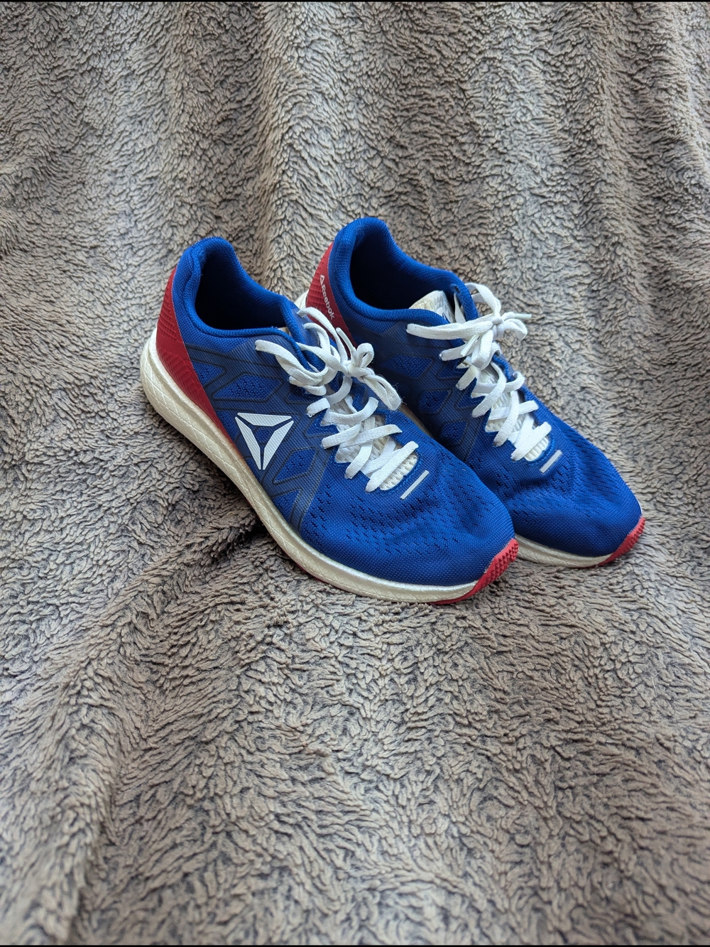 Reebok Men’s Blue Athletic Shoes with Red and White Accents